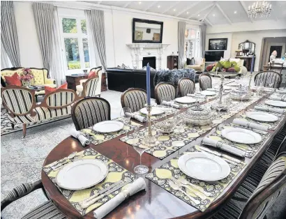  ?? PHOTOS: CHRISTINE O’CONNOR ?? The dining table was set for a recent Taieri Rotary Club fundraisin­g tour as it might have been in 1912. The silver centrepiec­e is by Tiffany and Co, circa 1879, and the matching entre dishes are by Paul Storr, circa 1806.