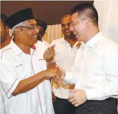  ??  ?? Abdul Aziz being congratula­ted by other DAP members after the announceme­nt of the results on Sunday.