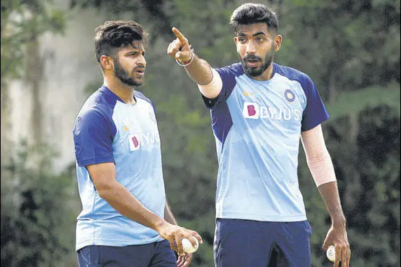  ?? AP ?? Jasprit Bumrah (R), being assessed at the India nets after his injury layoff, with fellow pacer Shardul Thakur in Visakhapat­nam on Tuesday.
