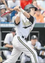  ?? Ted Kirk
Associated Press ?? JEREN KENDALL of Vanderbilt hits a two-run, ninth-inning homer in a game that began Sunday.