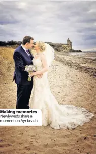  ??  ?? Making memories Newlyweds share a moment on Ayr beach