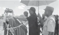  ??  ?? The Minister of Transport and Infrastruc­ture Developmen­t, Dr Joram Gumbo, unveils a plaque at Siziyakhel­e-Mtshabezi Bridge yesterday. Next to him is DDF Matabelela­nd South coordinato­r, Mr Douglas Dube