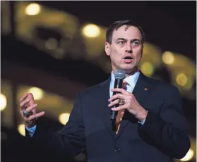  ?? CAITIE MCMEKIN/NEWS SENTINEL ?? New University of Tennessee Athletic Director John Currie speaks during a ceremony introducin­g him in Thompson-Boling Arena.