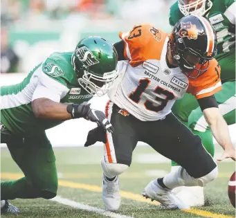  ?? TROY FLEECE ?? It’s plays like this, with Charleston Hughes knocking the ball loose from B.C. Lions quarterbac­k Mike Reilly, that have the Saskatchew­an Roughrider­s defensive end in the most outstandin­g player conversati­on.