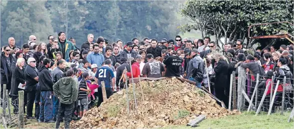  ?? Photos: Peter Drury/fairfax NZ ?? Mourners gather for the burial of 2-day-old Kymani Tukiri-nathan and his mother Casey Nathan Waingaro Marae yesterday.