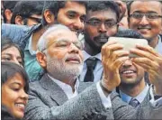  ??  ?? Prime Minister Narendra Modi poses for selfies with Indian students during a visit to the French National Space Agency in Toulouse on Saturday. REUTERS