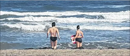  ?? SUBMITTED PHOTO ?? Alyssa Saulnier and Lily Maclachlan, both of Colchester County, were caught in a rip current recently during a visit to Melmerby Beach.