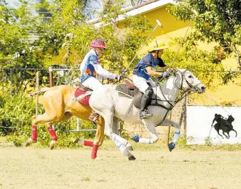  ?? CONTRIBUTE­D ?? West Indies Petroleum’s Mark Wates (left) chases ICWI’s Kurt Chin during the semi-finals of the Willie deLisser (Polo) Cup at the St Ann Polo Club in Drax Hall, St Ann on Thursday.
