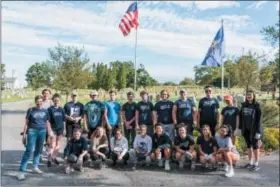  ?? SANDI YANISKO — FOR DIGITAL FIRST MEDIA ?? Hill School volunteers gather after spending Pottstown CARES Day working at Edgewood Cemetery.