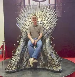  ??  ?? ABS-CBN president and CEO Carlo Katigbak sits on the HBO Game of Thrones iron throne