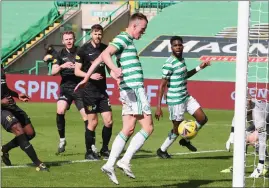  ??  ?? David Turnbull scores as Celtic romped to victory over Livi, whose boss David Martindale admitted didn’t get close to the Parkhead side