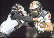  ?? / Steven Eckhoff ?? Pepperell’s Camron Miles (right) attempts to break free of Chattooga’s Jamarious Mosteller.