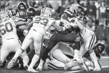  ?? BETTINA HANSEN/TRIBUNE NEWS SERVICE ?? Seattle Seahawks running back Chris Carson takes the ball across the line for a 1-yard touchdown in the second quarter against the Green Bay Packers in Seattle on Thursday.