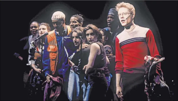  ?? Joan Marcus The Associated Press ?? Anthony Rapp, right, and the cast of “Rent” during a performanc­e of the 1996 musical. It will mark its 25th anniversar­y with a gala Tuesday that will be available to stream.