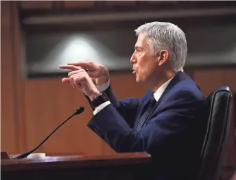  ?? JACK GRUBER, USA TODAY ?? Supreme Court nominee Neil Gorsuch testifies before the Senate Judiciary Committee during his confirmati­on hearing on March 22. He was confirmed by the full Senate 54-45 on Friday.