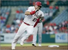  ?? ALEX GALLARDO AND MARK J. TERRILL — THE ASSOCIATED PRESS FILE ?? The Angels’ Mike Trout, above, was limited to 134 games, but nipped Houston’s Alex Bregman for the AL MVP; the Dodgers Cody Bellinger, below, was the NL MVP in another close race over Milwaukee’s Christian Yellich.