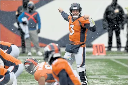  ?? HELEN H. RICHARDSON / The Denver Post ?? Broncos quarterbac­k Drew Lock communicat­es at the line of scrimmage Sunday against the Chiefs at Empower Field at Mile High in Denver.