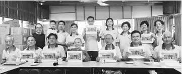  ??  ?? The building committee shows an artist’s impression of the Poh Ka Monastery during the press conference yesterday. Seen here are Law (seated second right), Kuching Poh Ka Buddha Temple chairman Ngiaw Mui Khak (seated third right), deputy chairman JP...