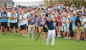  ?? JOHN RAOUX/AP ?? Kurt Kitayama hits a shot to the green from just off the 18th fairway during final round of the Arnold Palmer Invitation­al golf tournament Sunday in Orlando.