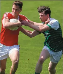  ??  ?? Declan Byrne holds off a challenge from Patrick Begley.