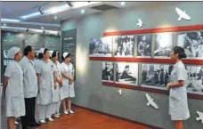  ?? PHOTOS PROVIDED TO CHINA DAILY ?? Left: Local medical workers visit the Bethune Memorial House in Wuhan, Hubei province. Right: A statue of Norman Bethune is a major attraction at the site.