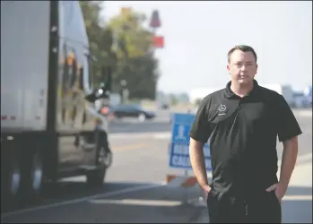  ?? NEWS-SENTINEL PHOTOGRAPH­S BY BEA AHBECK ?? On Wednesday, Lodi resident Anthony Bonnett stands at the intersecti­on at Flag City where two days earlier he pulled a big rig driver from the cab of his truck after it tipped over.