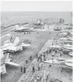  ?? KYODO NEWS/AP ?? U.S. Navy FA-18 Hornets cram the flight deck of the USS George Washington during a joint military exercise with Japan on Thursday.