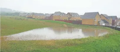  ??  ?? Flooding on the site of the planned 450-home developmen­t in Tondu in August 2016