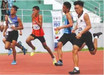  ??  ?? CEBU’S Kylie Kenjie Dahili (right) crosses the finish line first to rule the boys 100-meter run of the Batang Pinoy Games Visayas regional trackfest at the Gov. Mariano Perdices Stadium in Dumaguete City yesterday.