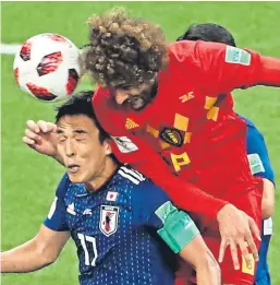  ?? AP. ?? Marouane Fellaini heads home Belgium’s equaliser.