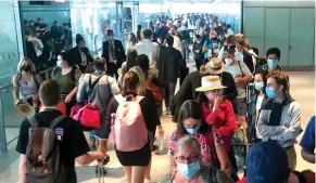  ?? ?? Long wait: The mammoth line of travellers at Heathrow on Sunday