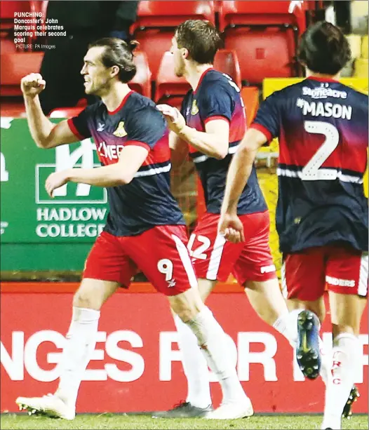  ?? PICTURE: PA Images ?? PUNCHING: Doncaster’s John Marquis celebrates scoring their second goal