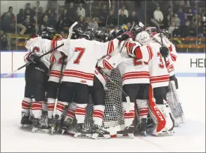  ?? John McCreary / For Hearst Connecticu­t Media ?? Fairfield Prep gathers around their goalie for a pre-game speech by the captains before Wednesday night’s state playoff game against Xavier in New Haven.