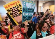  ??  ?? Mcdonald's workers carrying protest signs crowd the inside of a Mcdonalds restaurant in south Los Angeles on Tuesday, Sept. 18.