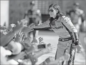  ?? AP/JOHN RAOUX ?? Danica Patrick greets fans as she is introduced before the Daytona 500. Patrick’s race was cut short after 101 laps because of a wreck.