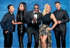  ??  ?? The Masked Singer host Nick Cannon, centre, with panellists, from left, Ken Jeong, Nicole Scherzinge­r, Jenny McCarthy, and Robin Thicke. Season four contestant­s include Lips, Giraffe and Dragon, top.
