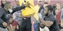  ?? STEVEN CANNON/ASSOCIATED PRESS ?? Dalvin Cook, right, widely considered a 1st-round prospect, works on a drill with an NFL scout during FSU’s pro day on Tuesday in Tallahasse­e.