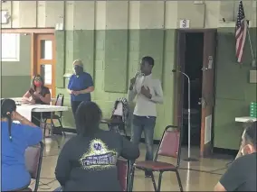  ?? RICHARD PAYERCHIN — THE MORNING JOURNAL ?? William Morse, 12, a student at Longfellow Middle School, was the youngest person to speak at a Sept. 2community meeting to discuss ways to help young people in the community. The crowd of about 50people gave him a standing ovation in the St. Francis Cabrini Parish gymnasium in South Lorain.