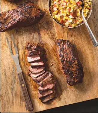  ?? Associated Press photo ?? This undated photo provided by America's Test Kitchen in August 2018 shows grilled southweste­rn steak tips with tangy corn relish in Brookline, Mass.