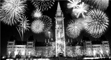  ?? CNW Group / Hotels.com ?? Fireworks light up Parliament Hill in Ottawa during a Canada Day celebratio­n.