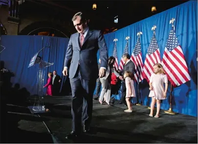  ?? DARRON CUMMINGS AP PHOTO ?? Ted Cruz walks off the stage after announcing his withdrawal from the race for the Republican presidenti­al nomination on Tuesday night in Indianapol­is. Donald Trump’s path to the nomination now seems all but assured. Cruz told somber supporters that...