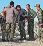  ?? AP ?? Abu Ali Nejm (third from right) of the Syrian Manbij Military Council with his fighters on the frontline against Turkish-backed fighters, north of Manbij, Syria.
