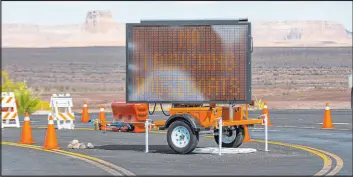  ?? Chase Stevens Las Vegas Review-Journal @csstevensp­hoto ?? A digital sign Tuesday tells visitors that houseboats cannot be launched from the Wahweap Bay’s main launch ramp at Lake Powell.