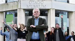  ?? PHOTO: PETER MCINTOSH ?? Reprieve . . . Otago Museum director Dr Ian Griffin and staff members yesterday celebrate new Dunedin City Council funding.