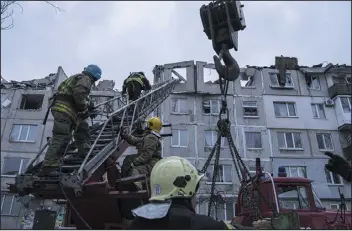  ?? EVGENIY MALOLETKA — THE ASSOCIATED PRESS ?? Rescue workers clear the rubble of a residentia­l building destroyed by a Russian rocket in Pokrovsk, Ukraine, on Wednesday. According to local authoritie­s, two people were killed and 12wounded.