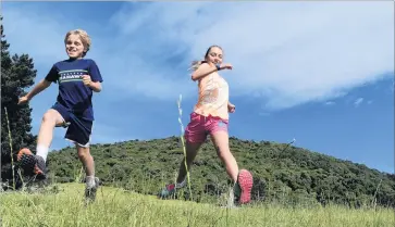  ??  ?? Fresh and fit . . . Siblings Eleanor (12) and Charlie (10) Baldi, of Dunedin, were the first up and down Saddle Hill during a public open day yesterday.