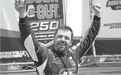  ?? AP ?? Josh Berry celebrates winning the rain-delayed NASCAR Xfinity Series auto race at Martinsvil­le Speedway in Martinsvil­le, Va., on Sunday.