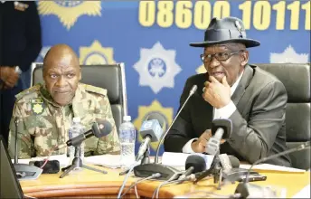  ?? PICTURE: SIBONELO NGCOBO/AFRICAN NEWS AGENCY (ANA) ?? Police Minister Bheki Cele addressed the media yesterday on progress in investigat­ions into KwaZulu-Natal political killings. Next to him at Durban police headquarte­rs was national police commission­er General Khehla Sitole.