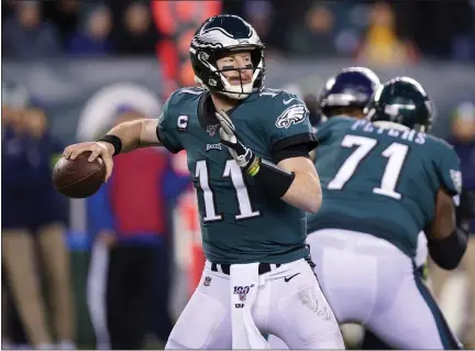  ?? CHRIS SZAGOLA — THE ASSOCIATED PRESS ?? In a Jan. 5, 2020, file photo, Philadelph­ia Eagles’ Carson Wentz passes during the first half of a wild-card game against the Seattle Seahawks in Philadelph­ia.