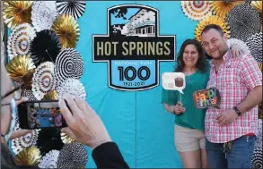  ?? (The Sentinel-Record/Richard Rasmussen) ?? Karen Strawbridg­e and Mike Rozak get their photo taken during Hot Springs National Park’s 100th anniversar­y event Thursday. The recently engaged couple was visiting from Copley, Ohio.